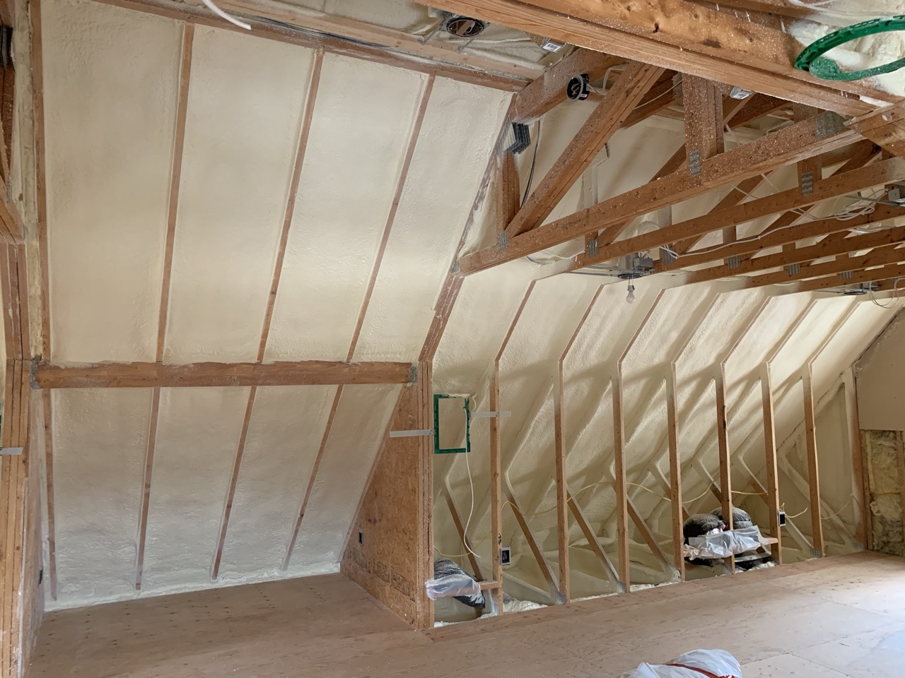White insulation boards on rafters for home insulation Fargo.