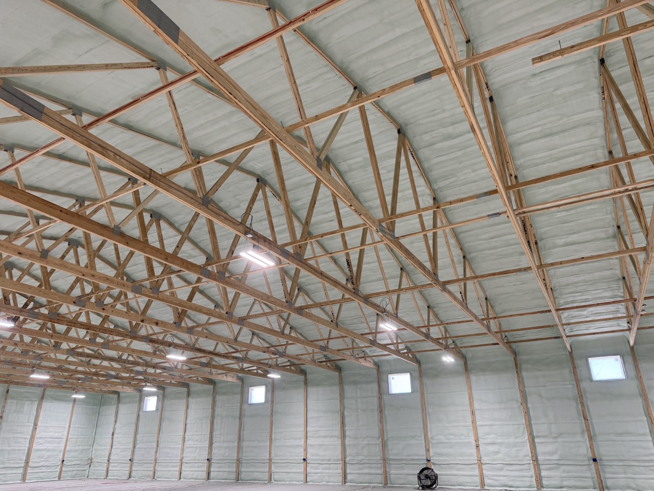 Large warehouse interior with complete spray foam insulation.