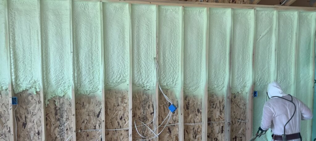 Spray foam insulation inside wall cavities